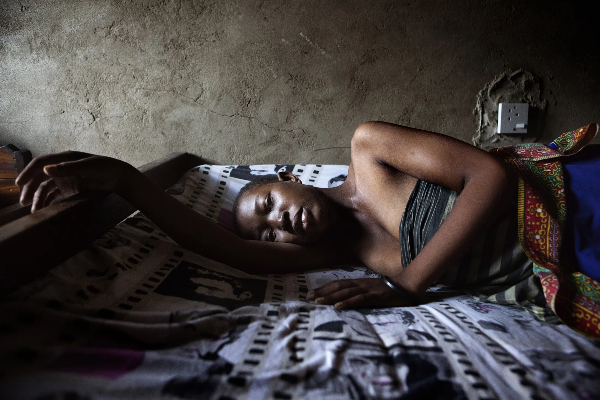 Flora Cosmas, 22 years old has HIV and TB. She has just been diagnosed for the first time with TB and will start the drugs immediately. She was too sick to attend the clinic, so she will be nursed from home.