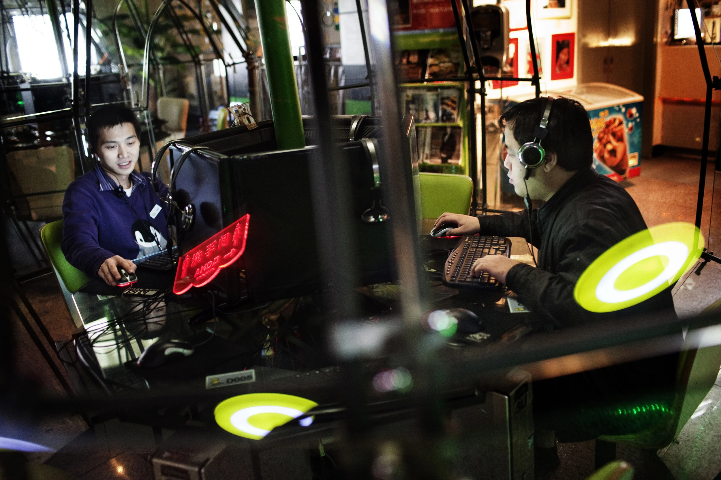 Young men surf the web in an Internet cafe in Beijing. The internet is creating a huge need for information in China. Many play online games and spend hours if not days at the computer. Addiction is an increasing problem amongst the young.