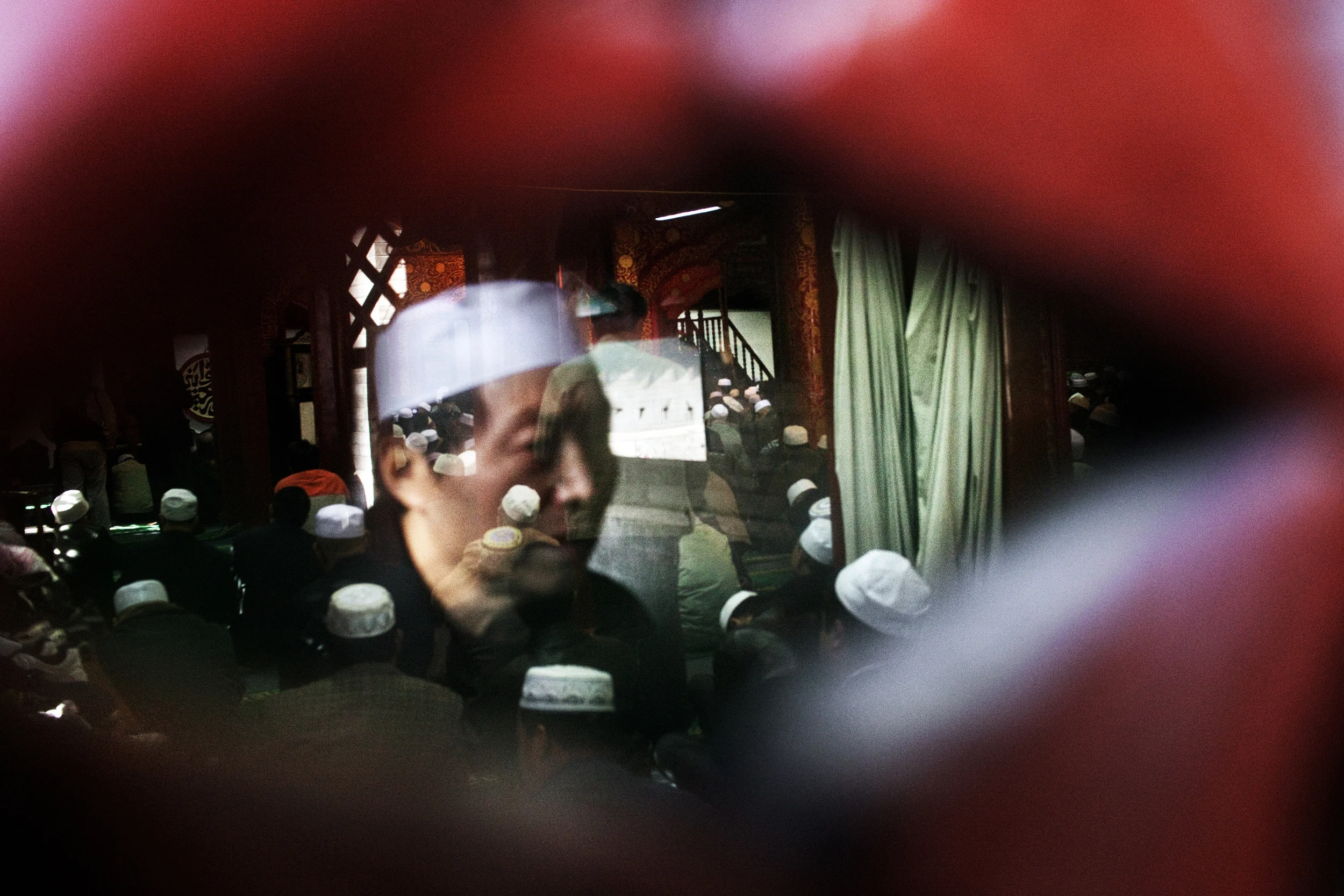 Local Muslims pray at Friday prayers at Niujiu Mosque or Ox Street Mosque, Beijing’s largest. China has 56 ethnic groups, many in its border regions. In recent years these have suffered from riots against perceived discrimination by the ethnic Chinese, or "Han," majority.