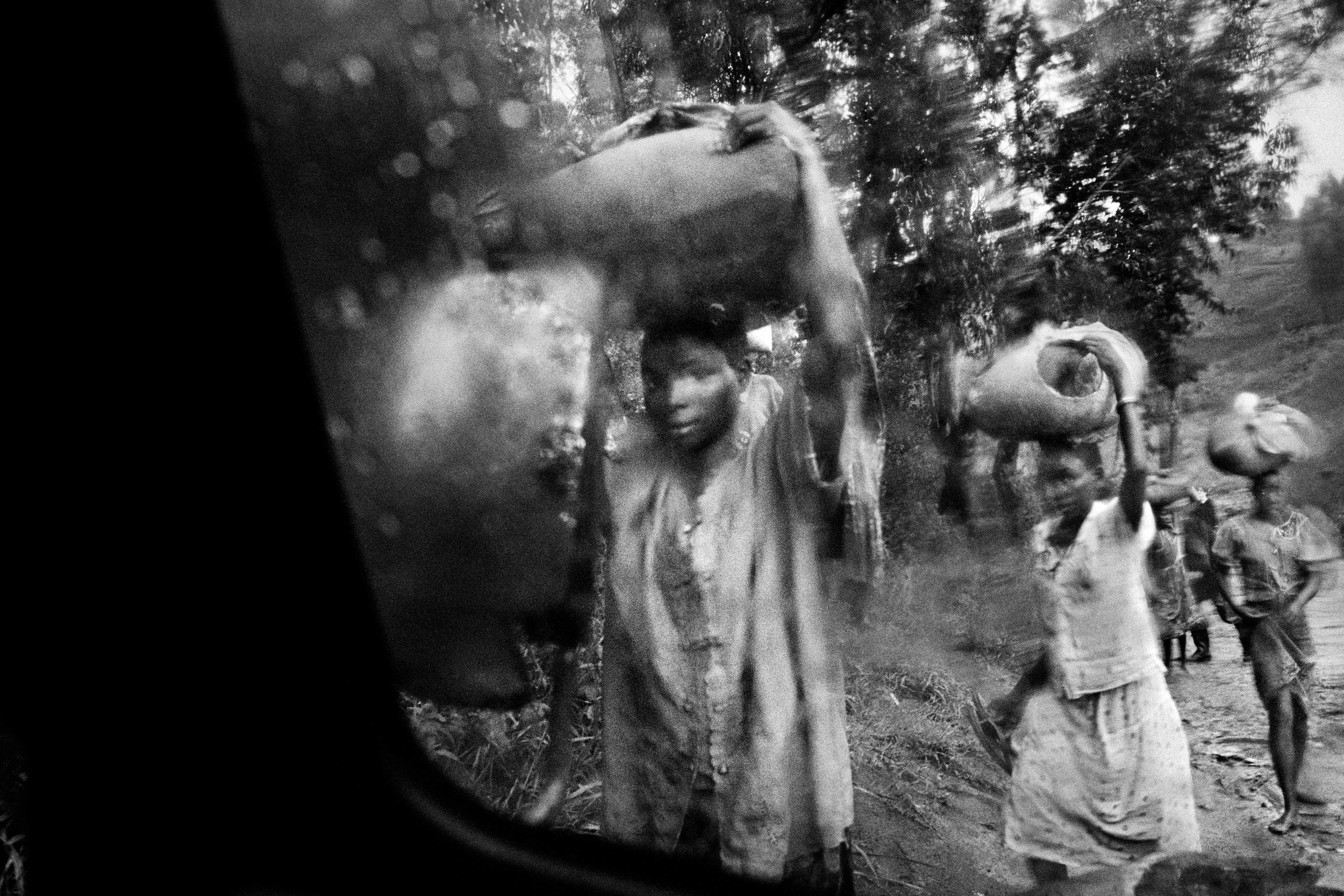 Refugees flee south after a rebel attack on Bule and Fataki, northeastern Congo. 2003