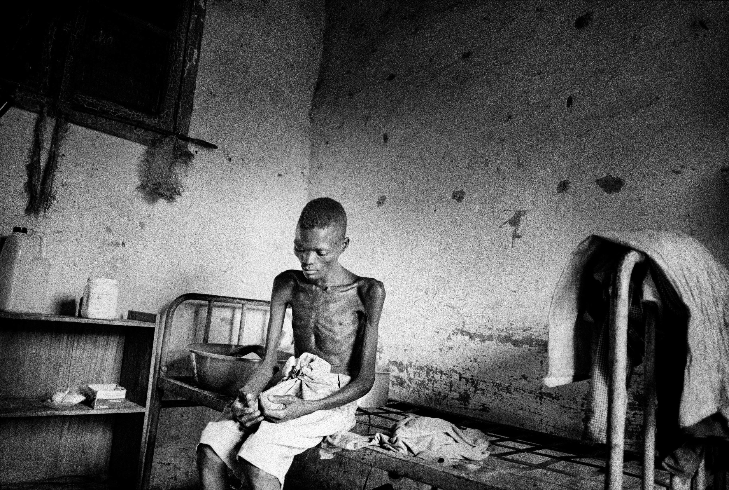 A gold miner suffering from tuberculosis in Mongbwalu, northeastern Congo, is left to fend for himself in a sanatorium. Most of the miners in this region are combatants who have controlled mineral-rich areas and are profiting from resource exploitat