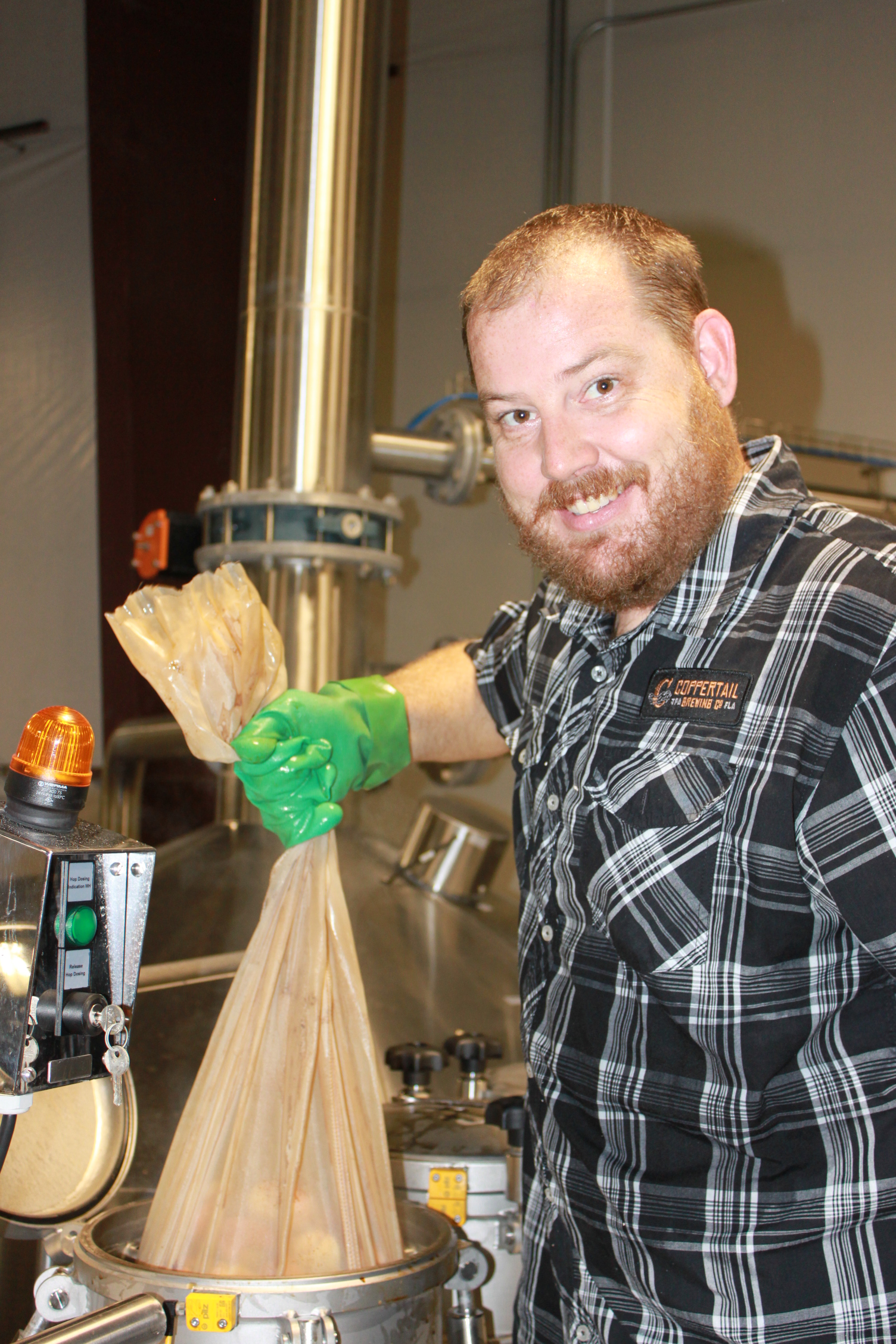 Casey pulling some of Captain Jack's crab claws from the boil.