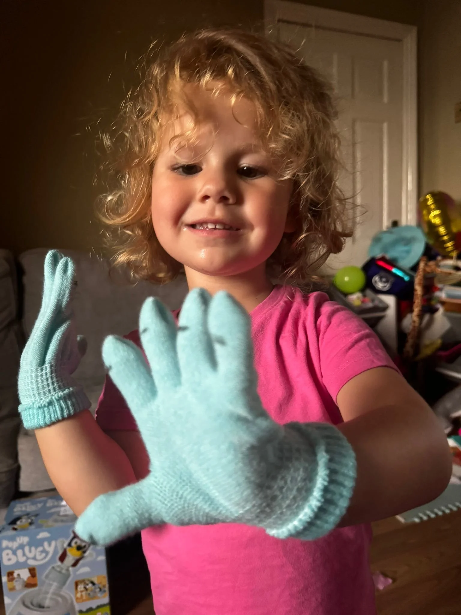 A child wearing gloves