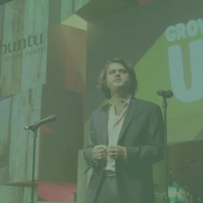 A man standing on a stage at a charity Gala