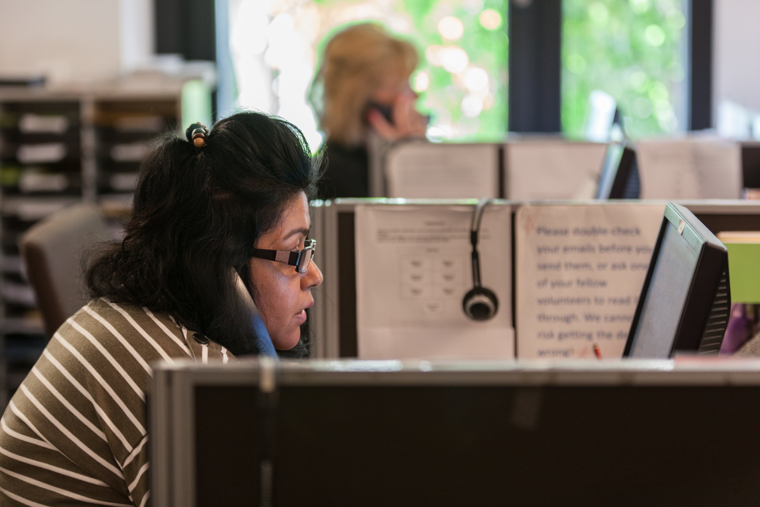 A woman on a telephone headset