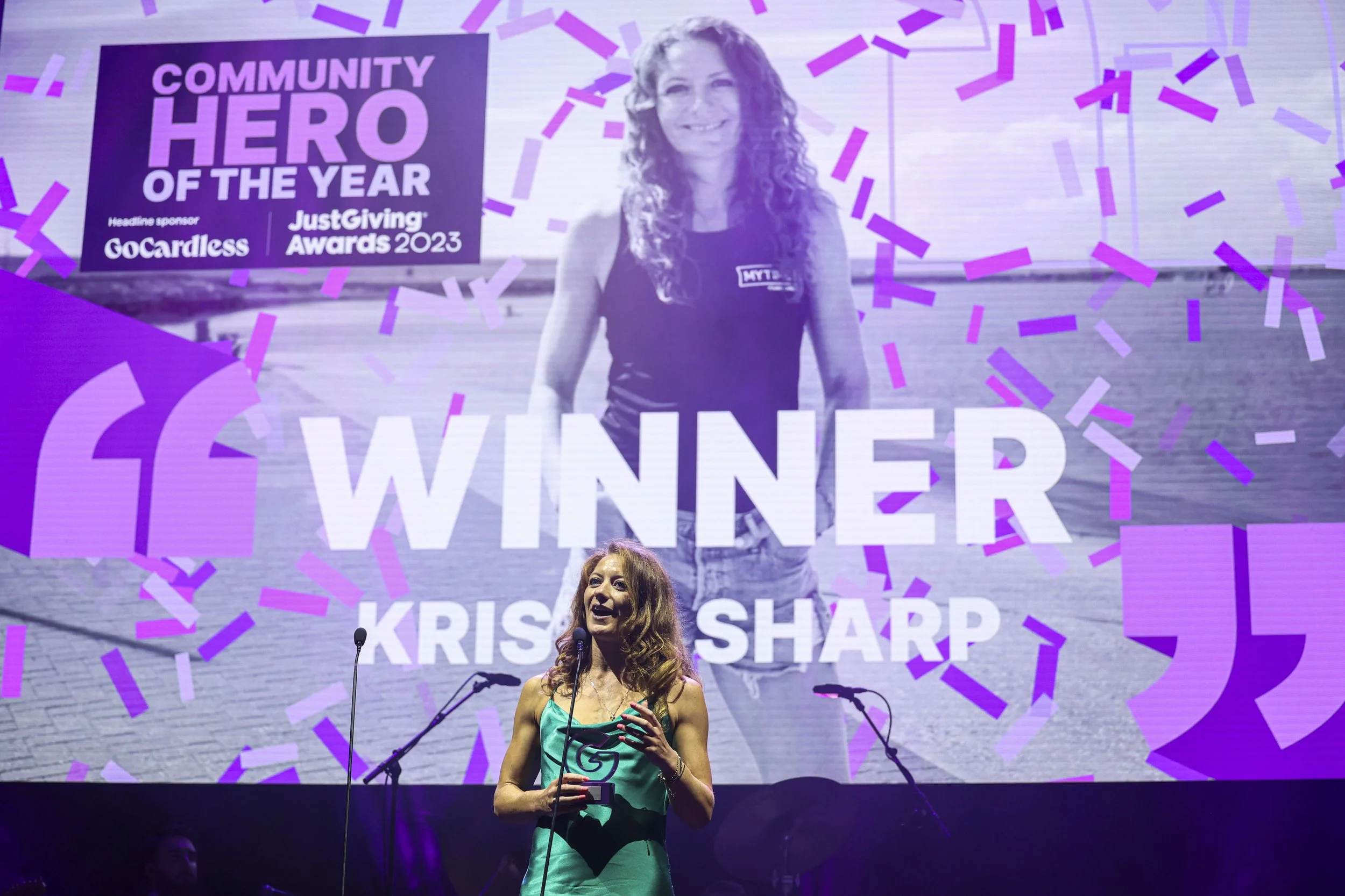 JustGiving award winner on a stage