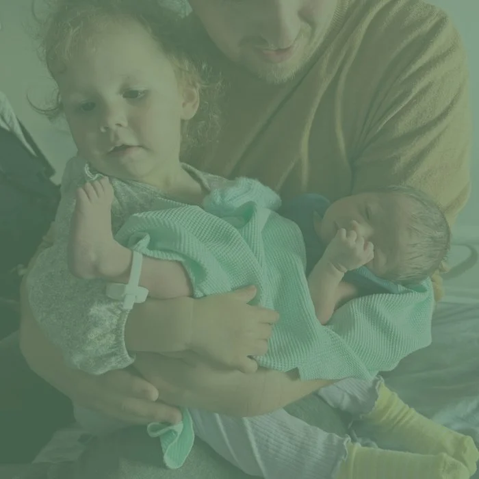 Young family cuddling together