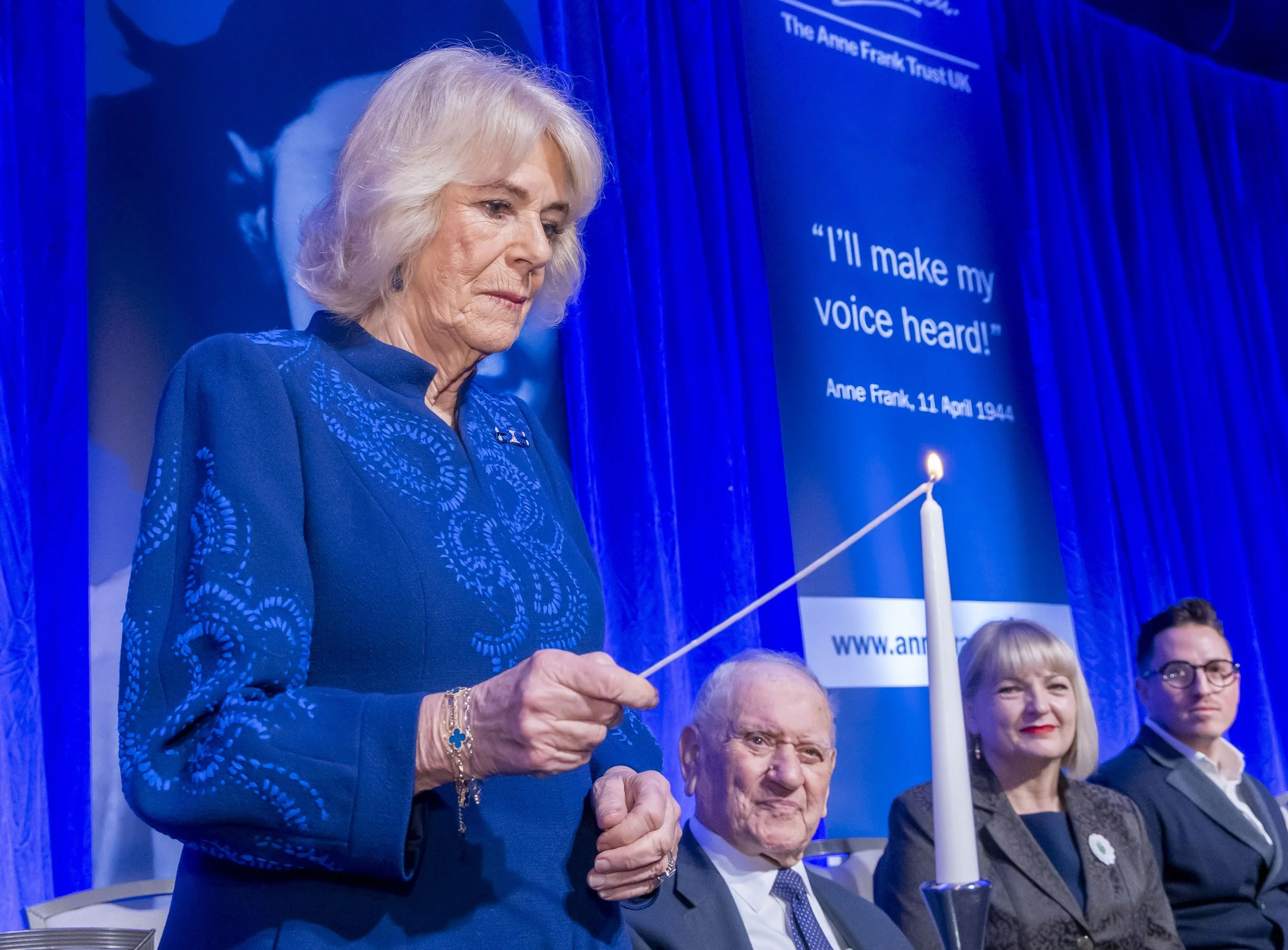 HRH The Queen lighting a candle