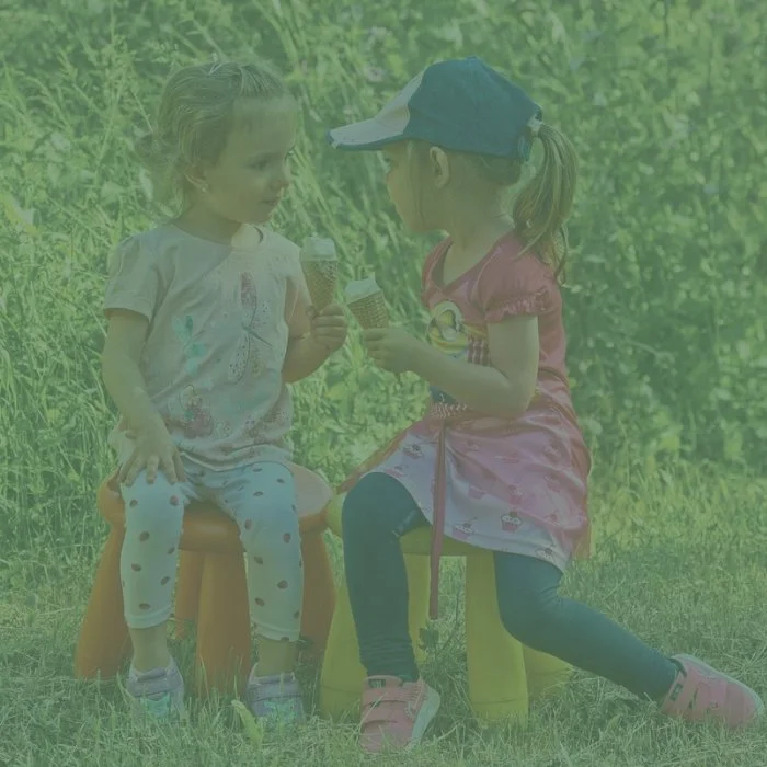 Two children eating ice cream