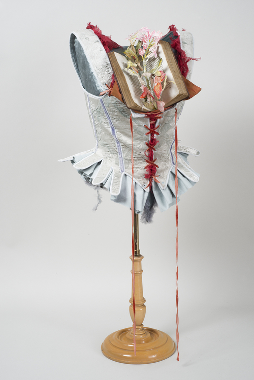 Boned corset with first edition of The Memoirs of Mrs. Coghlan, Daughter of the Late Major Moncrieffe , J. Fellows, New York, 1795 .