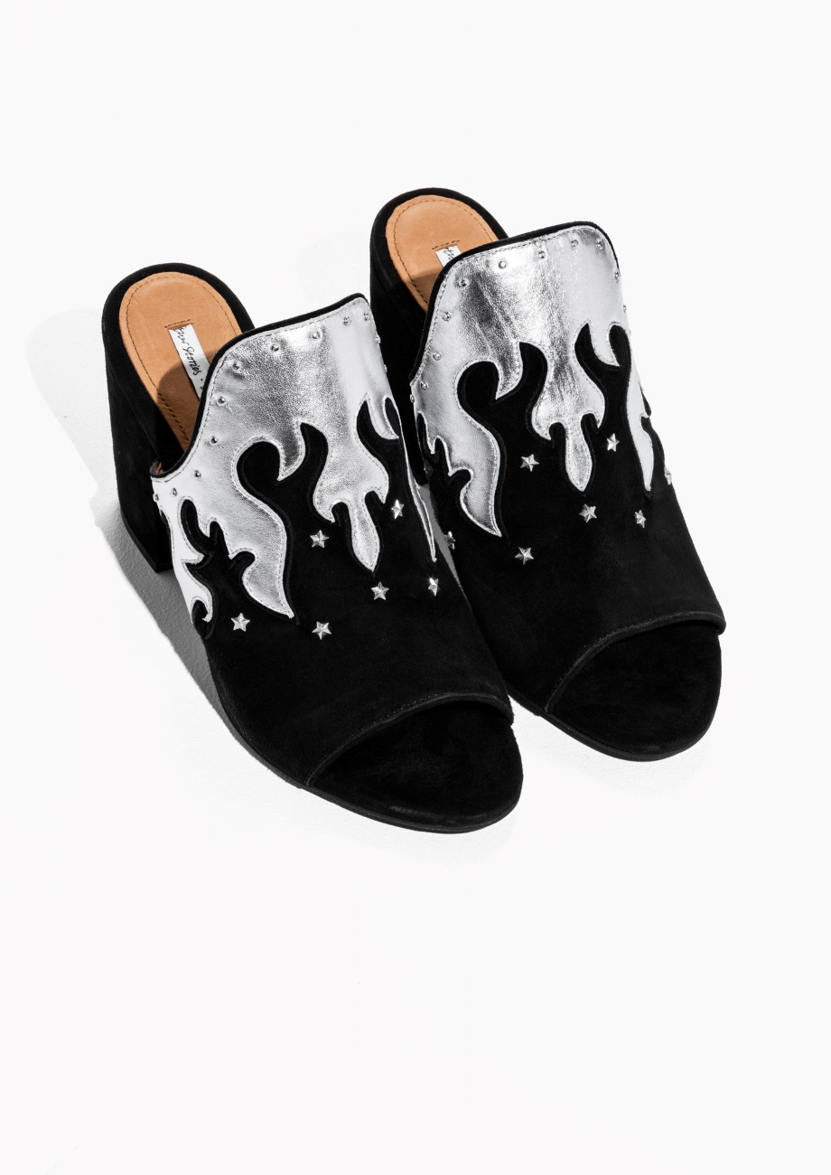 We could all use some metallic flames. Metallic Flames Suede Mules. (via stories.com )