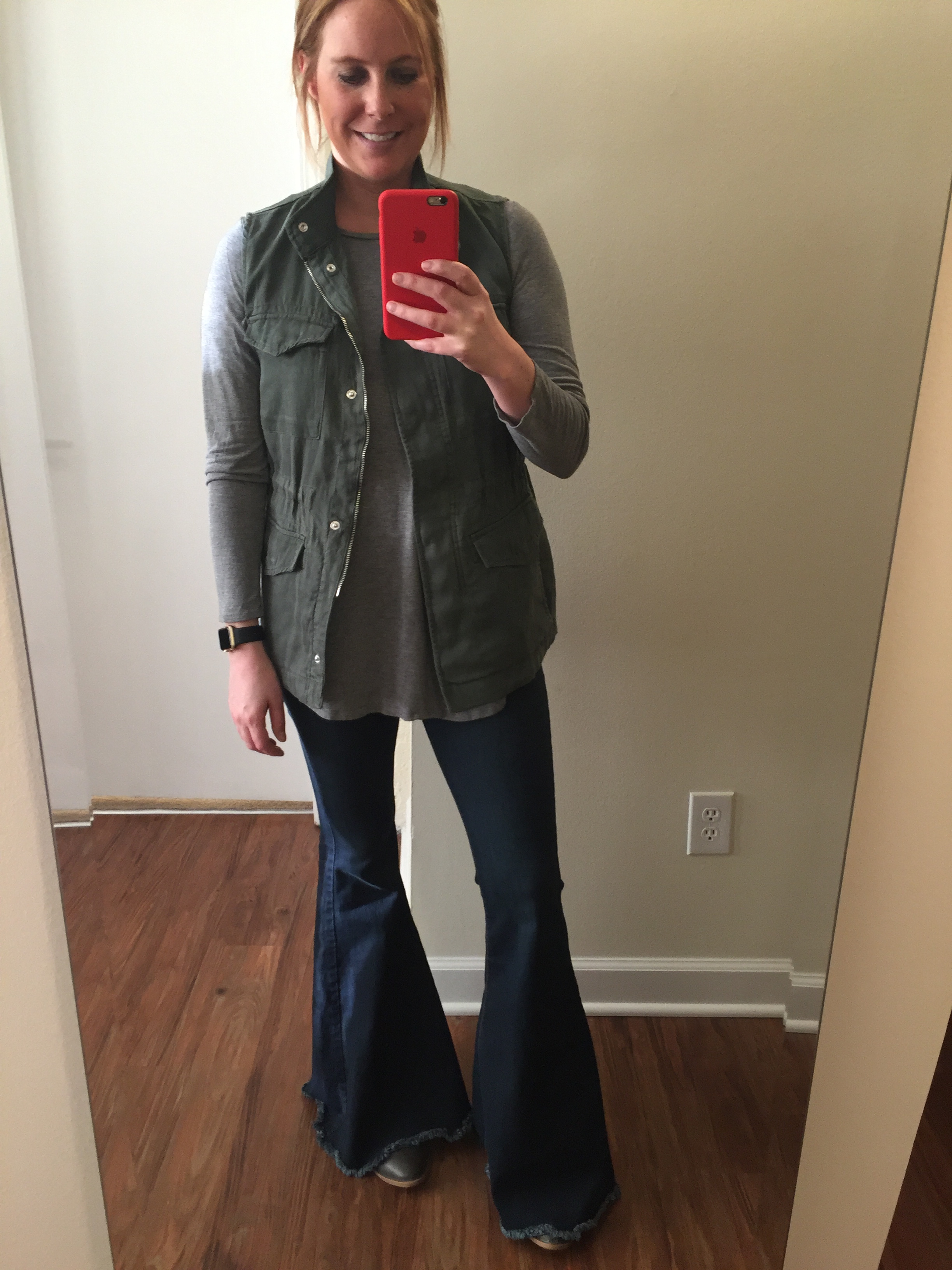 Vest: Gap, Tencel®utility vest , Tee: Old Navy, Long & Lean Ribbed Tunic , Jeans: Free People, Denim Super Flare , Watch: Apple, 38mm Gold Aluminum Case (with Black Sport Band) 