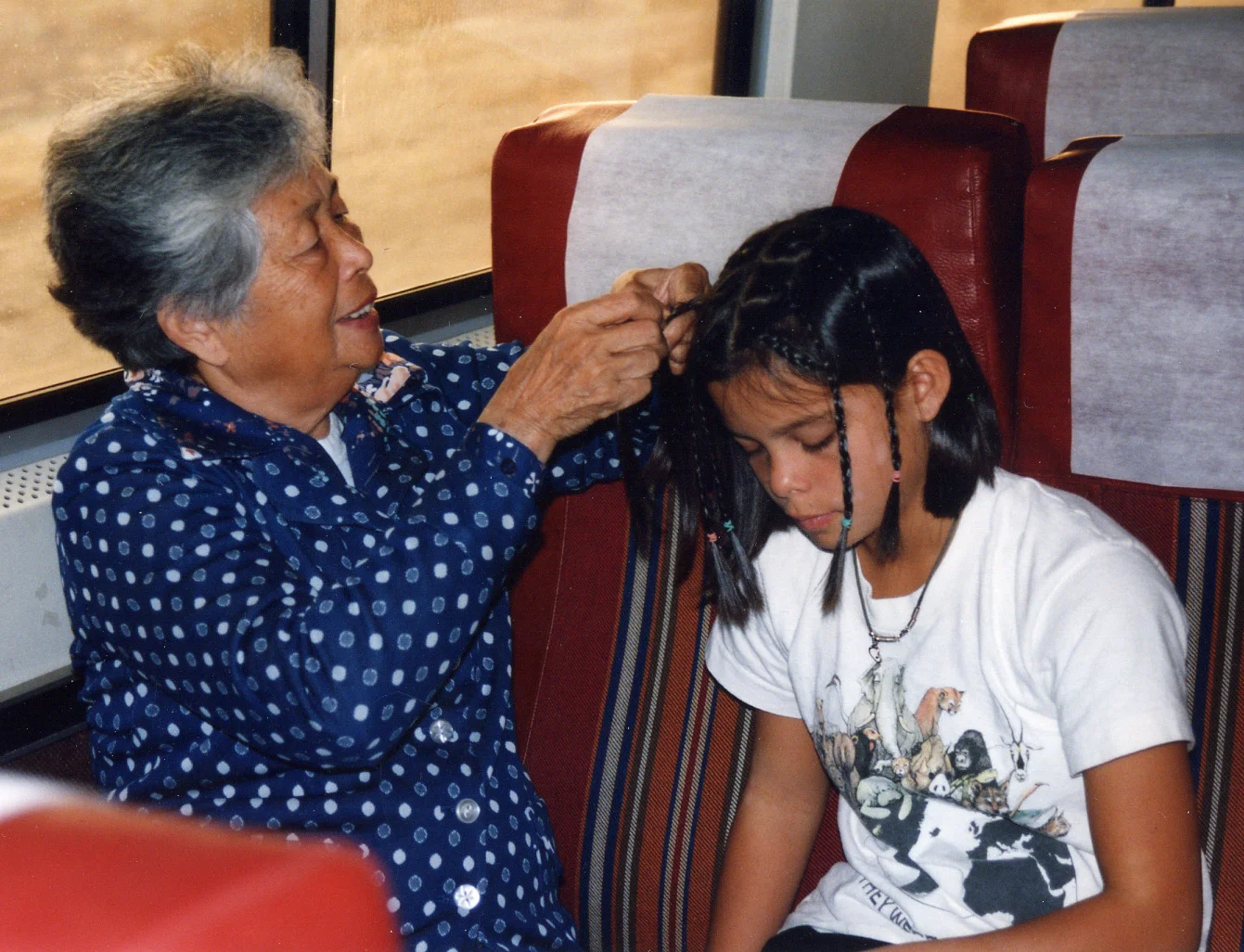 124 Grandma Josie braiding hair.jpg