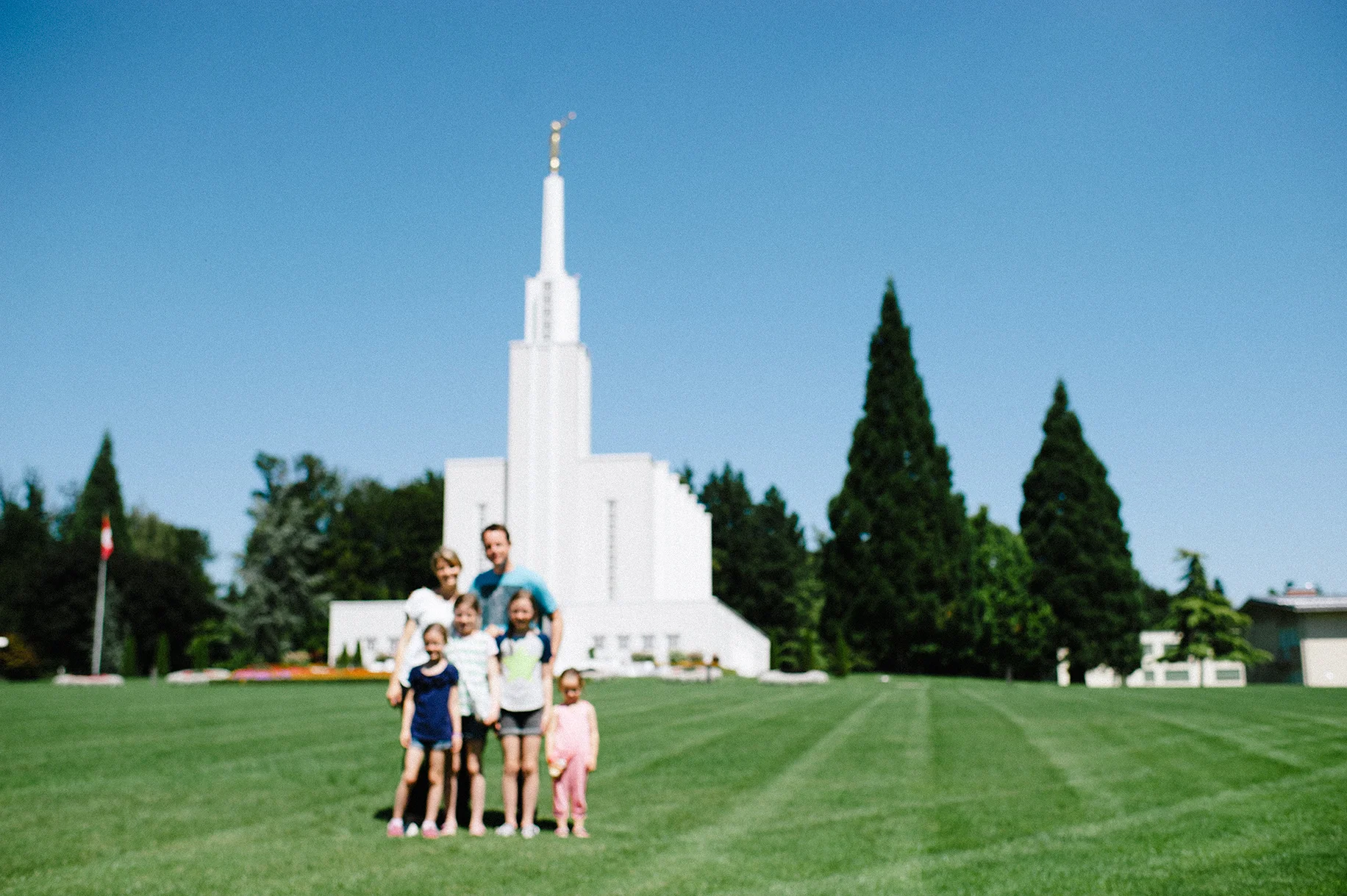 This is what happens almost every time when Brian hands over his camera to get our family picture. :) But, we tried!