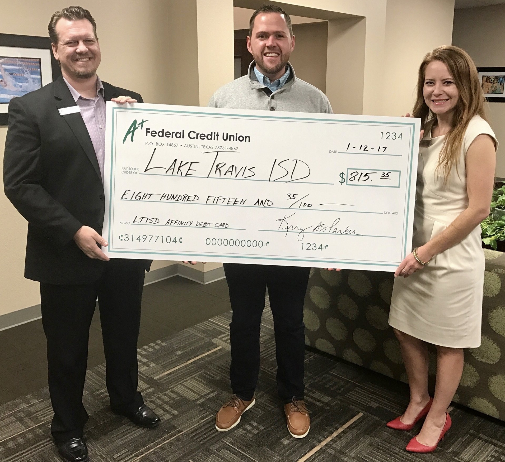 (left and right) A+ FCU representatives, (middle) Kevin Claypool, LTISD Director of Development & Corporate Relations