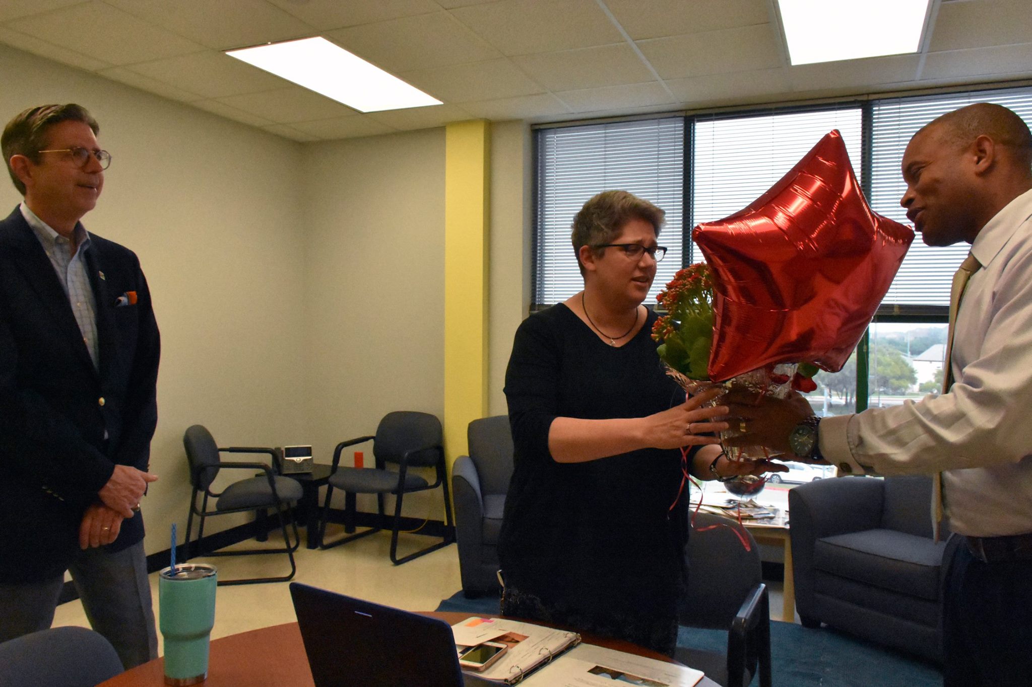 Dr. Brad Lancaster and principal Gordon Butler surprised Ms. Holden with the announcement of being named the Lake Travis High School 201-2018 Campus Teacher of the Year.