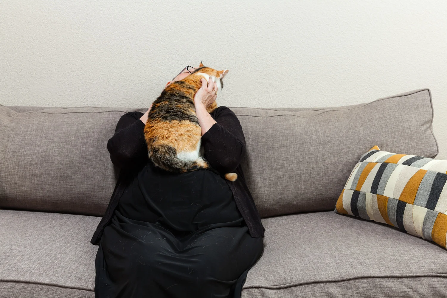 Chris, her cat, her cat's fur, couch, and pillow. So, mixed media.