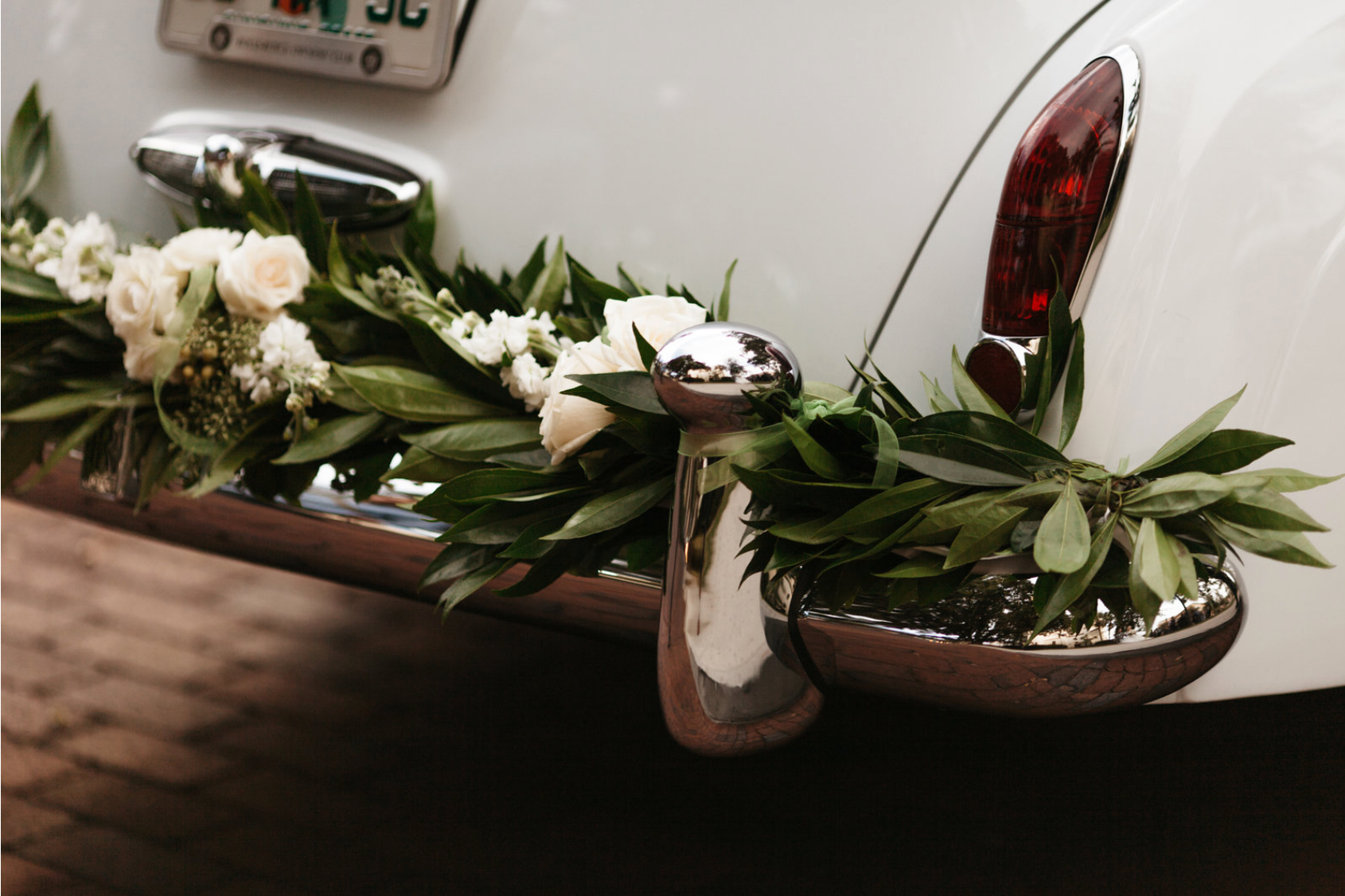 Photo Credit: Chris Glenn Photography What about a floralscape for the getaway car after the wedding? 