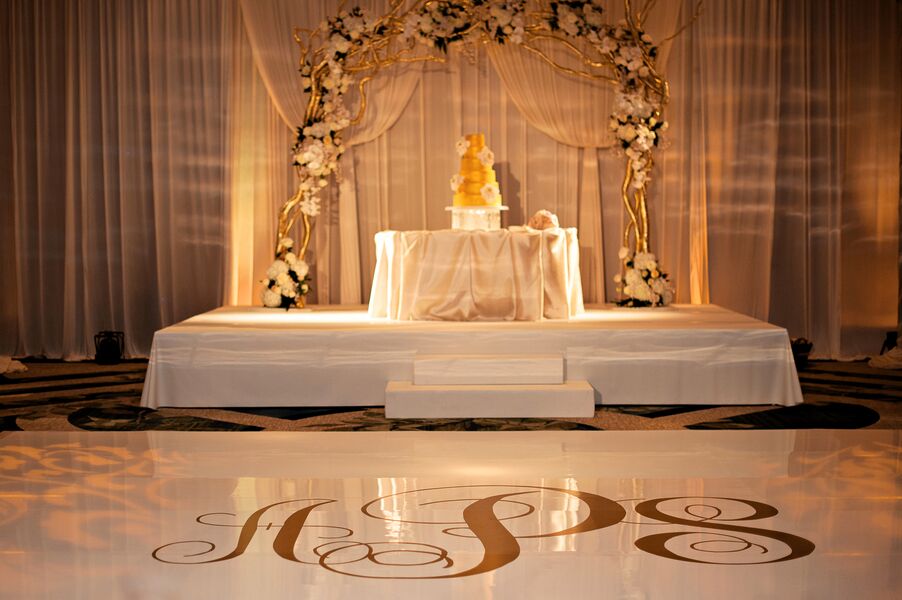 Photo Credit: Kristen Weaver A dance floor is complete unless it has a beautiful design on it right? On this special day the bride and groom wanted their initials customized on the dance floor. 