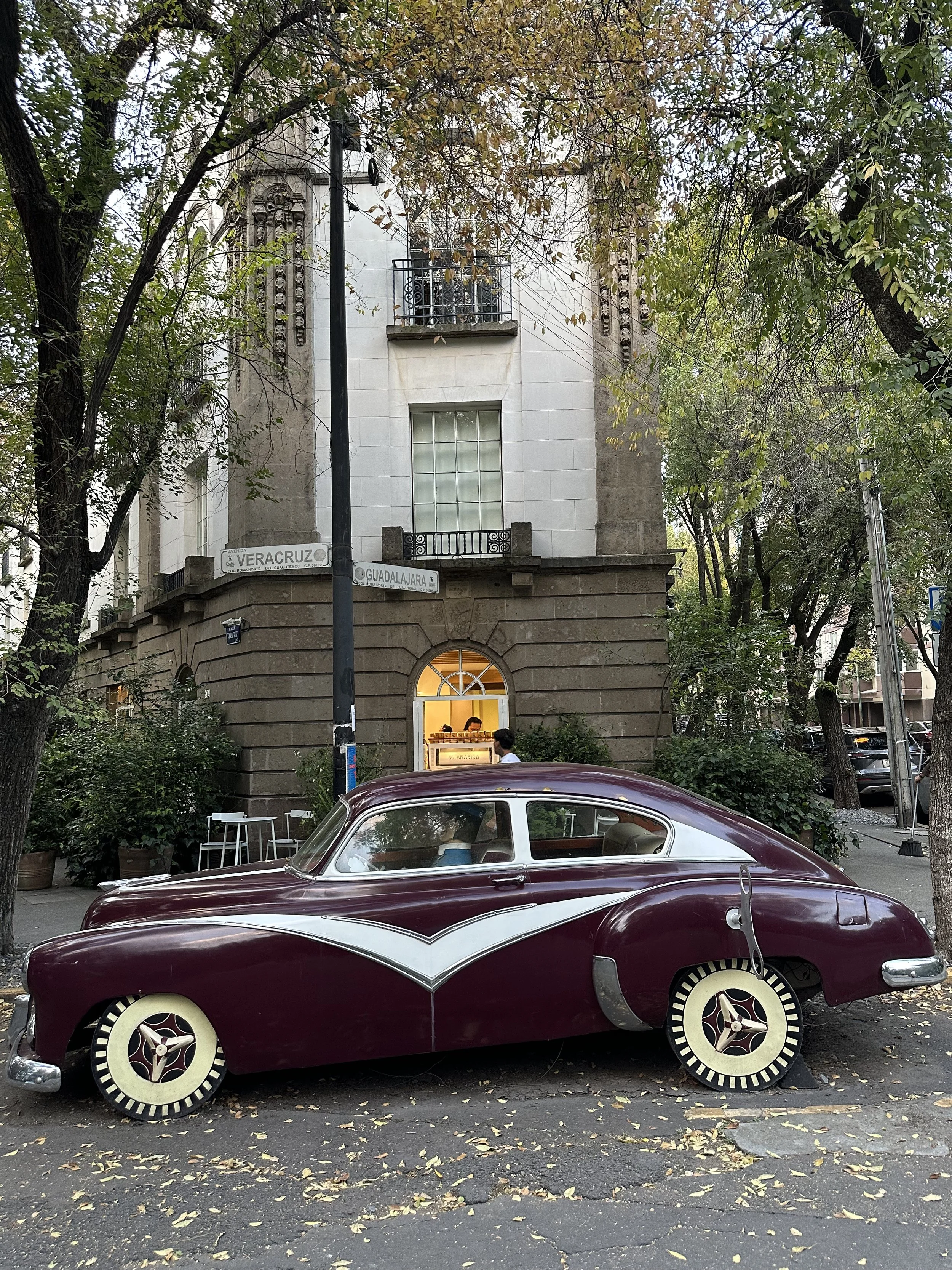 Car detailed like a toy parked infront of the Hotel Condesa