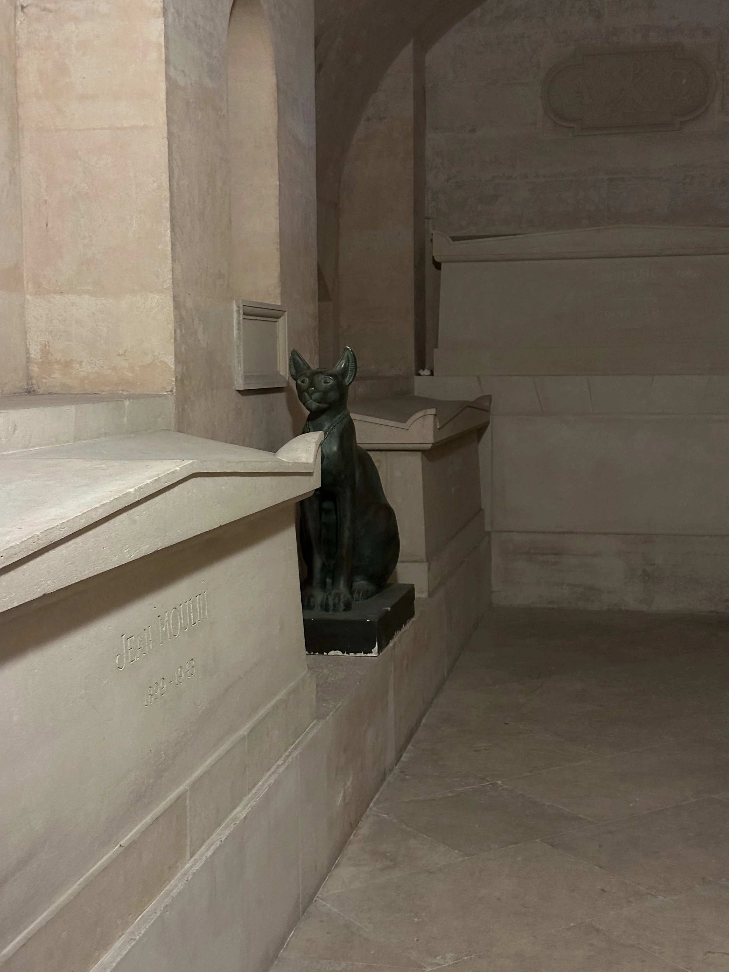 Biblioteque Ste. Genevieve Stone Statue of a Cat in a Dark Corner of the Entry Foyer