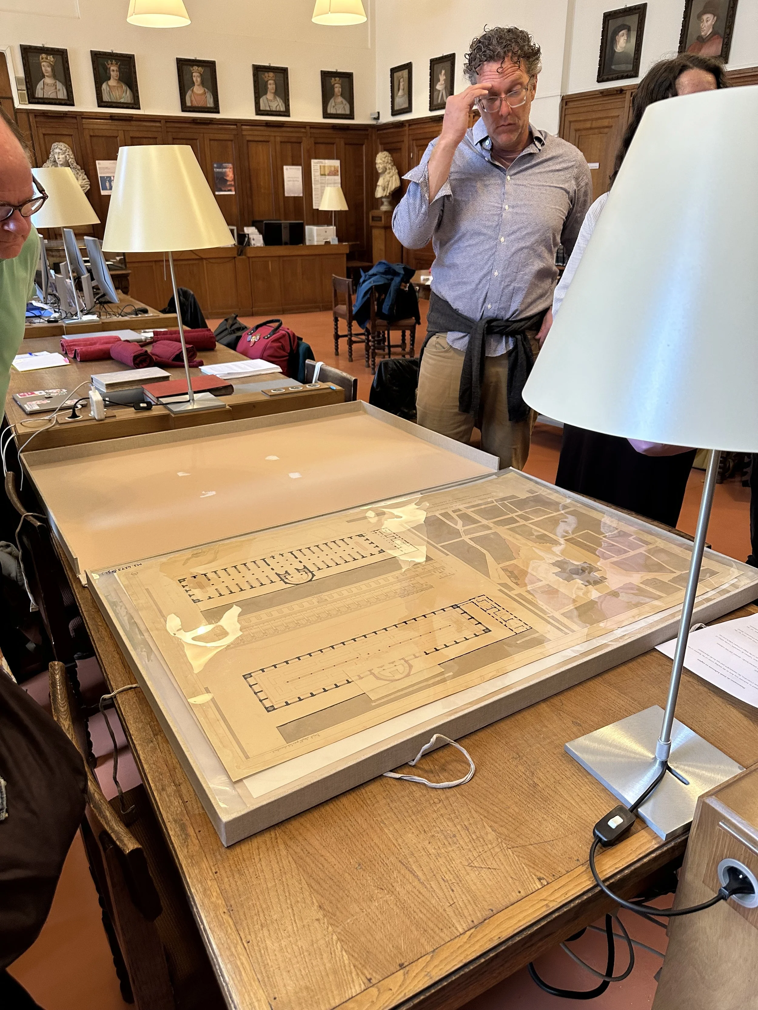 Biblioteque Ste. Genevieve Group of Architects Gathered Around the Plans of the Library