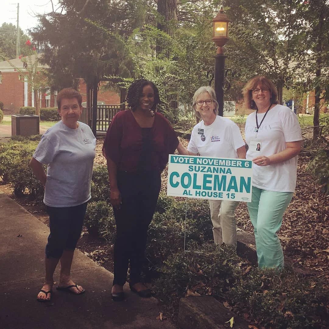 Suzanna Coleman (center, with burgundy top) and supporters