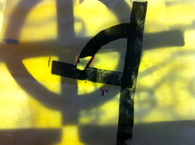 Marker on tissue paper image of deconstructing the register mark. Photographed on a light table.