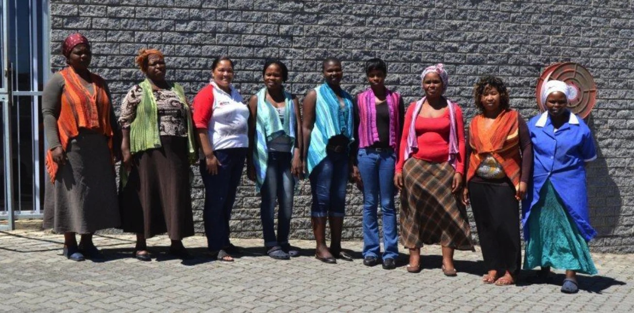 Pictured above from left to right are Vinnis dedicated team: Nomanganisa Bhane who balls yarn. Nontuthuzolo Sylvia Finca who balls yarn. Elma Daniels who is Vinnis assistant and multi skilled in dyeing and balling. Qhawekazi Nkabi who is multi skilled and dyes yarn. Noncedo Ndamase who skeins and balls yarn. Pakama Adams who balls yarn and is in training for dyeing. Vuyelwa Ketwa who balls yarn. Nombukelo Gladys Booi who skeins and balls yarn. Nolubabalo Alicia Adams who is multi skilled and dyes yarn.