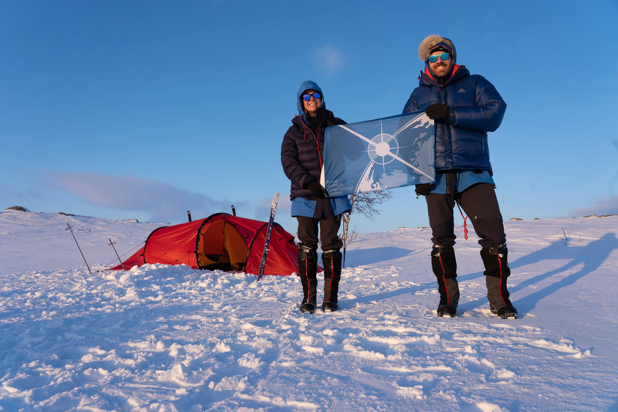 Hazel and Luke with the RSGS flag on Finnmarksvidda