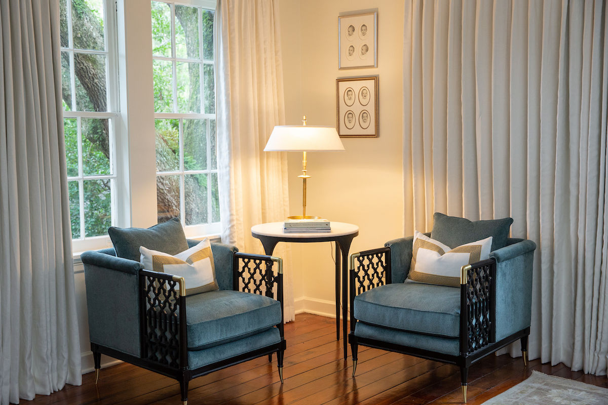 Look how much custom draperies warm up this master suite seating area. Floor to ceiling draperies make a big impact!
