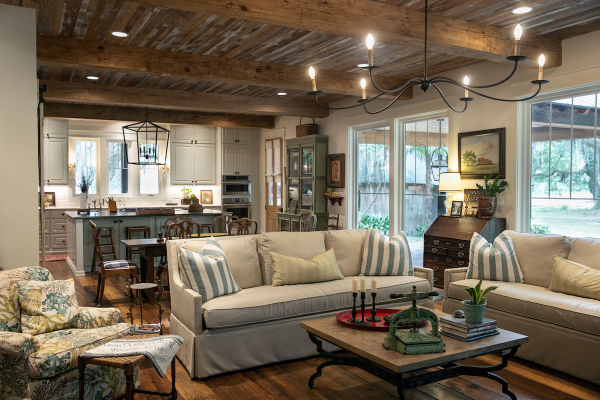 Large, “4-over-1” windows look out upon stately oaks, highlighting one of the home’s best features - its setting.