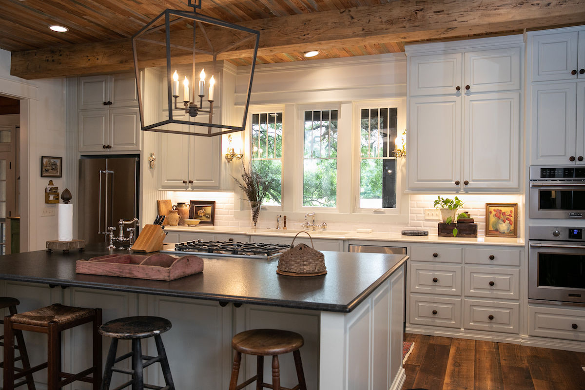 When looking to highlight a house’s best features, remember to look up! Melane found gorgeous cypress tongue-and-groove in the property’s original garage, so she repurposed it for a unique ceiling.