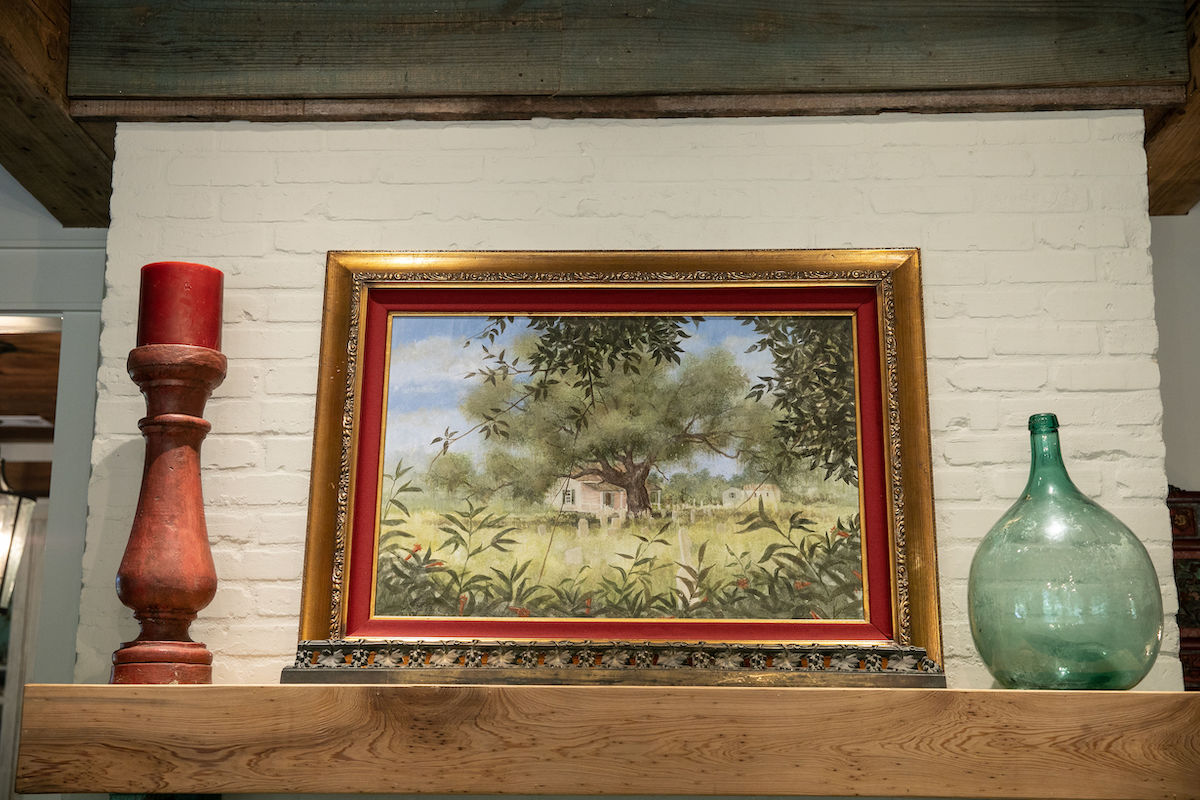 For the living room mantel, Melane chose to incorporate a very special piece of antique cypress from her late nephew’s outdoor kitchen.