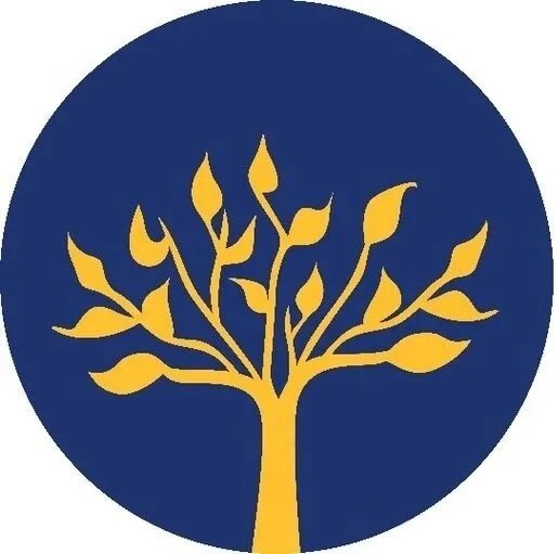 A gold tree with multiple branches and leaves inside a dark blue circle.