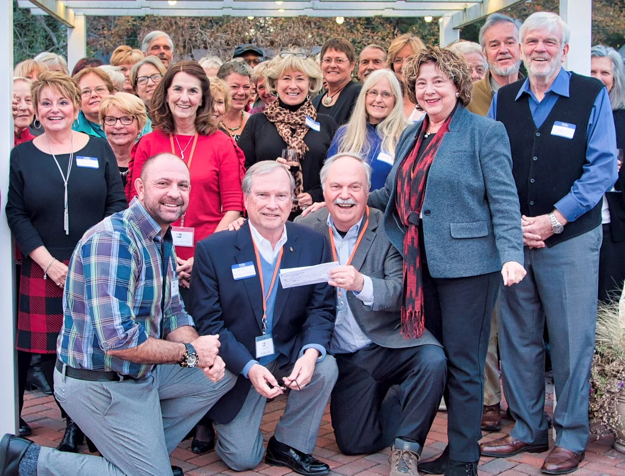 Many of our volunteers at the 2017 Delaware Botanic Gardens Volunteer Appreciation dinner stand behind Gregg Tepper, Cam Yorkston, Ray Sander and Sheryl Swed who are displaying the grant check from the Ellice & Rosa McDonald Foundation.