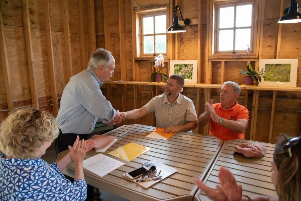 Ray Sander congratulates Brian Trader on accepting Director of Horticulture position with Brent Baker, Carol McCloud and Sheryl Swed.