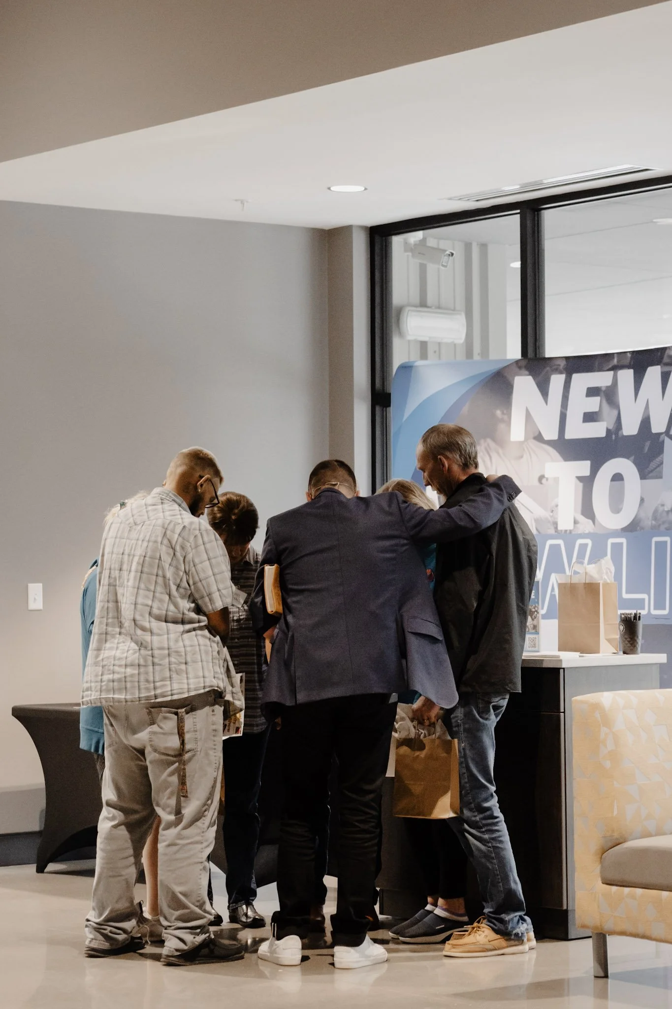 Praying at new to new life table .jpeg