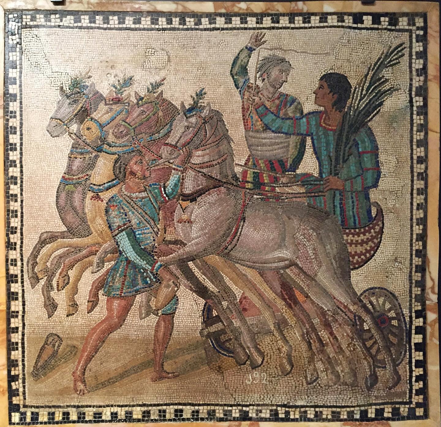 Hello #mosaicmondayinspiration ! I recently dug out a picture of this fabulous mosaic of quadriga (four-horse abreast) chariot and can&rsquo;t get enough of it!⁣
The guy with a tiny hand raised up is called a iubilator. He announces the winners. The 