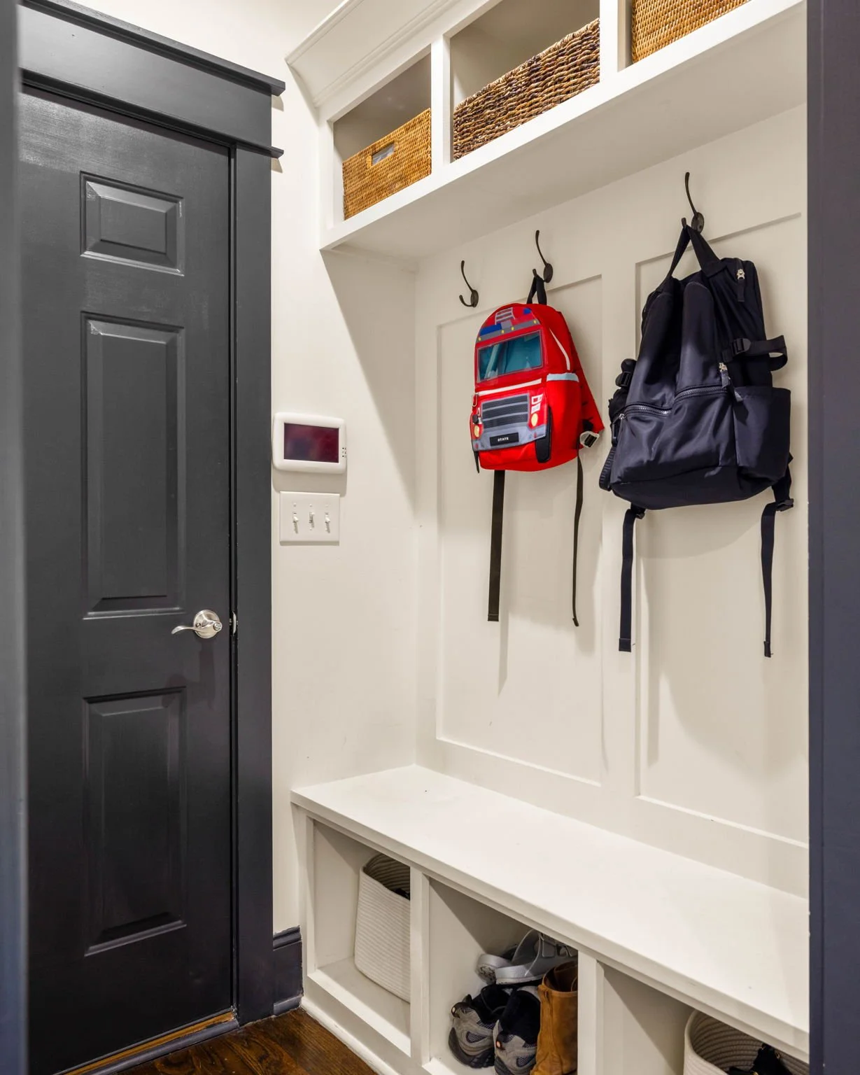  Mudroom with custom built-ins off 2-car attached garage 