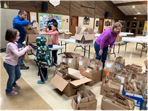 2025 12 Stuffing bags for the homeless.png