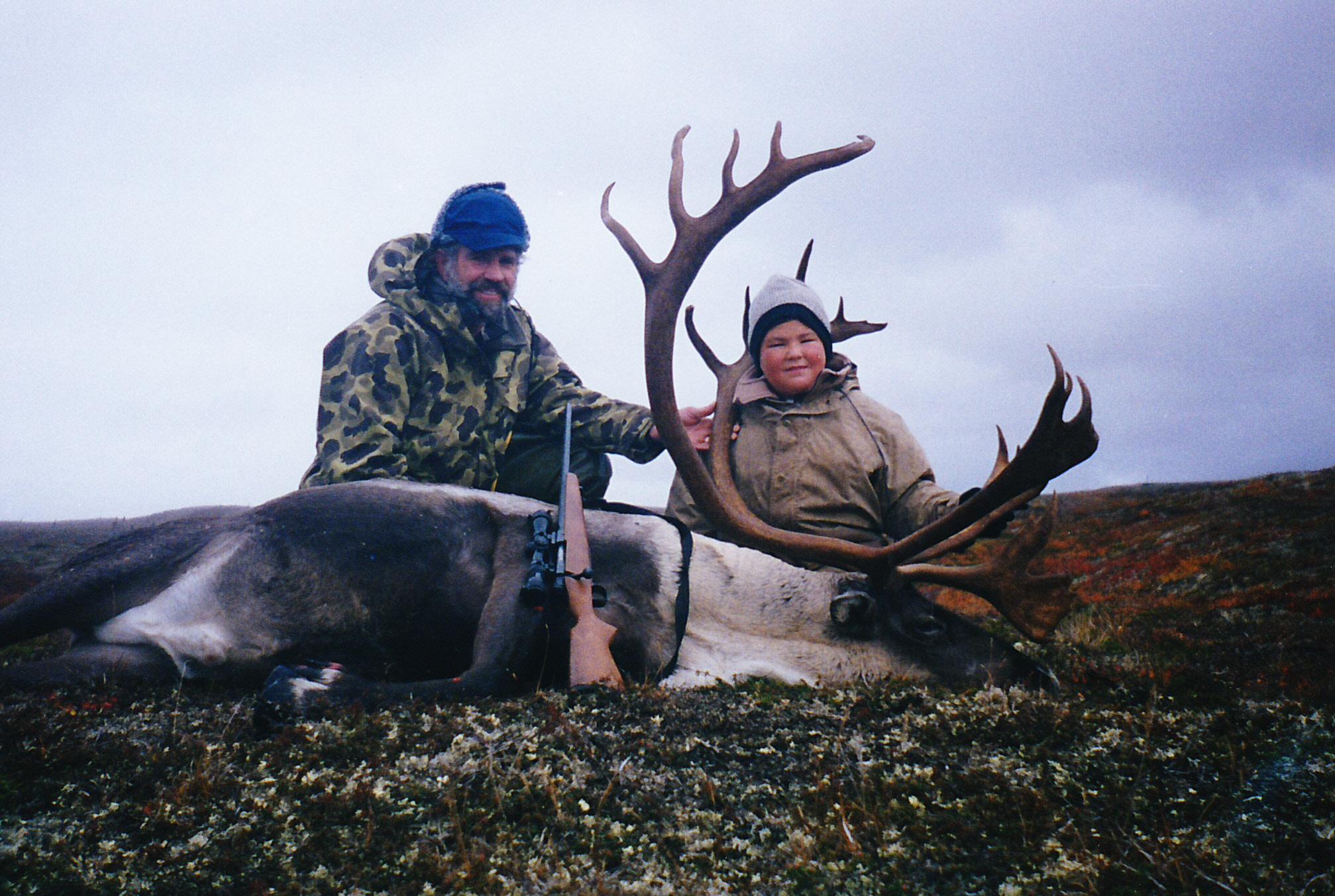 My grandson Greg and me with his first big game animal.