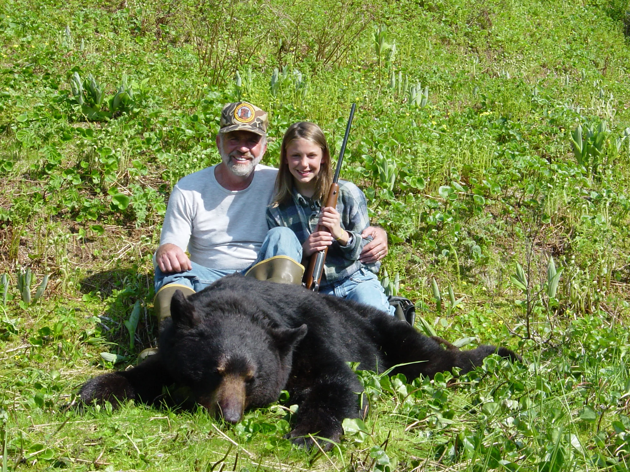 Granddaughter Jordan and me with her 6'8" black bear.