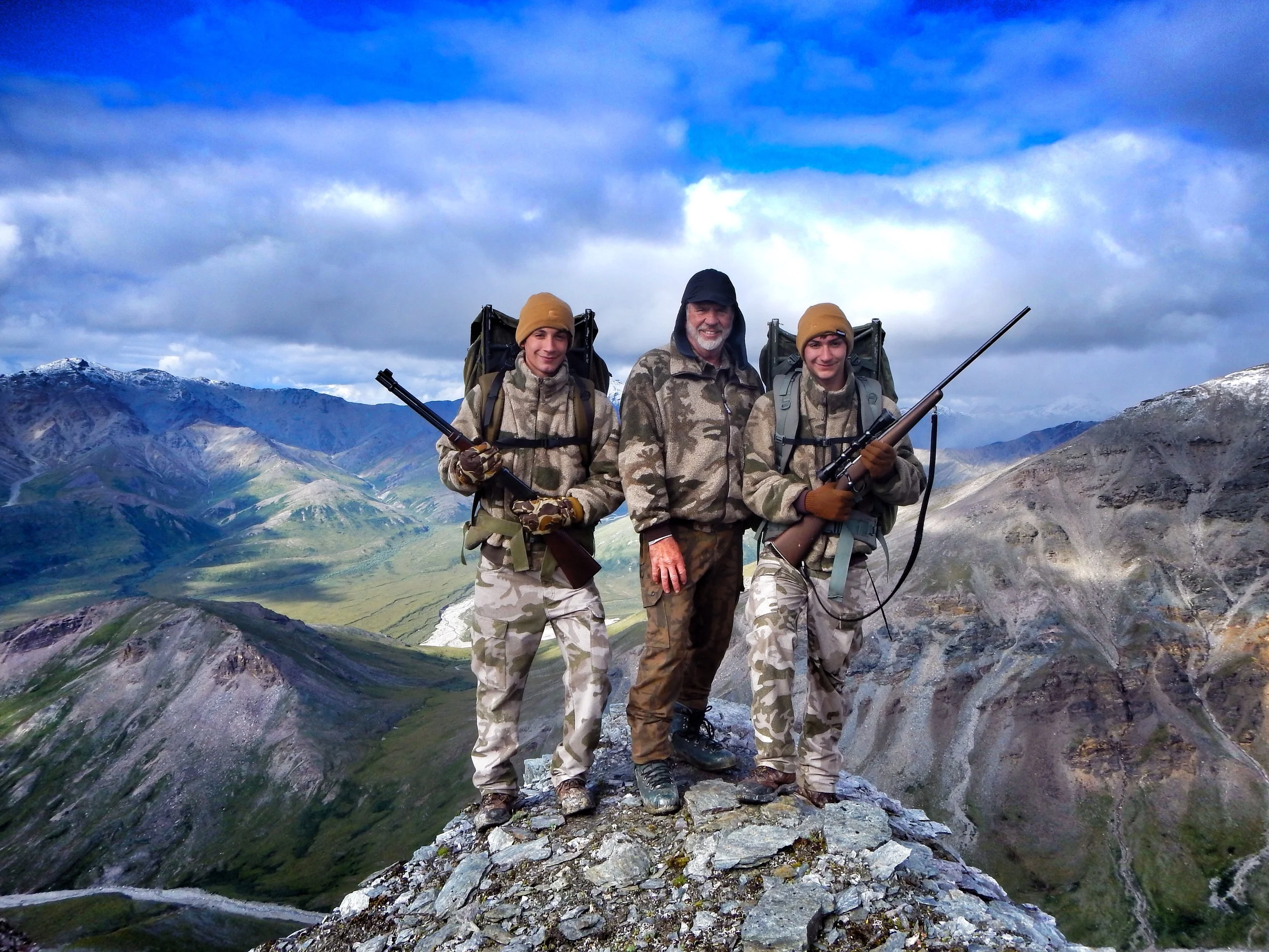 Here I am celebrating my 71st birthday with my grandsons, Jared on the left and Nathan on the right. I'm teaching these two fine young men to become sheep hunters which is a real joy for me. 