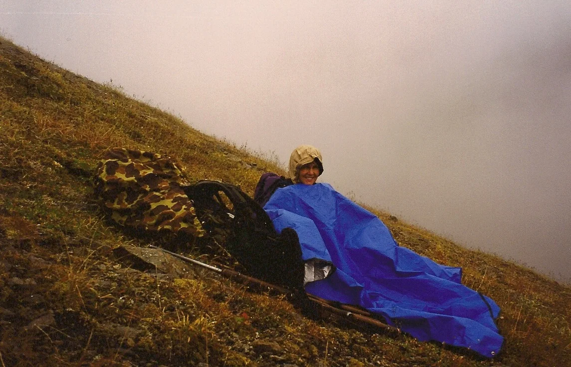 Karen enjoying her wedding anniversary. Waiting in the rain hoping the clouds will lift.