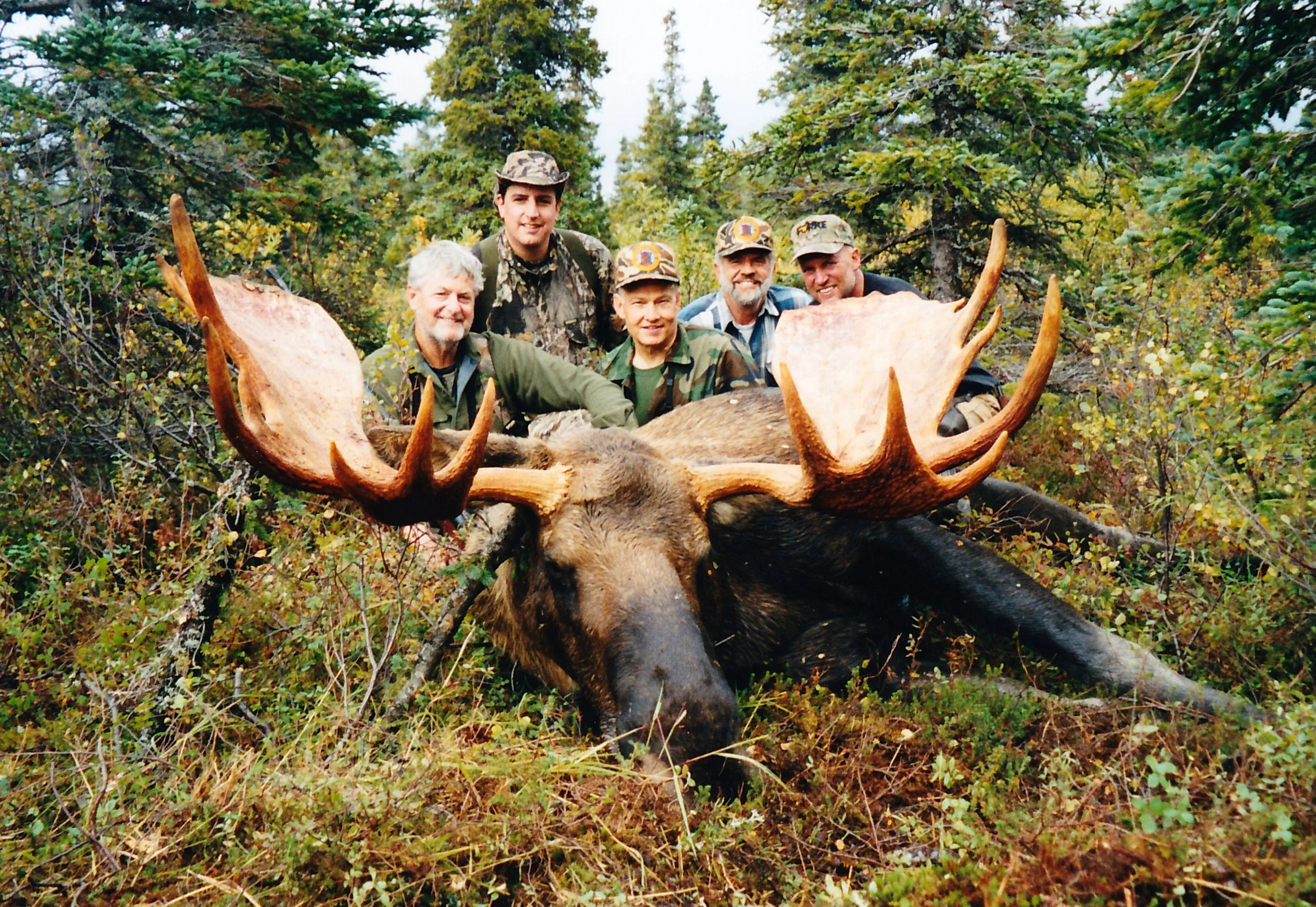 (L to R) Clients Tom Wells and his son Tom Jr., guide Ron Watts, myself and guide/packer Tom Losk with Tom's 58" moose.