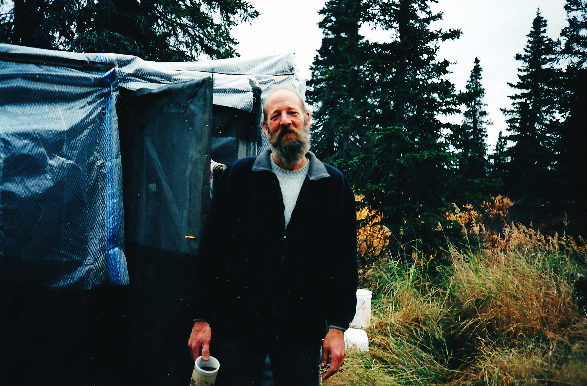 Chris standing by the meat house. He spent many long hours there working on the skins.