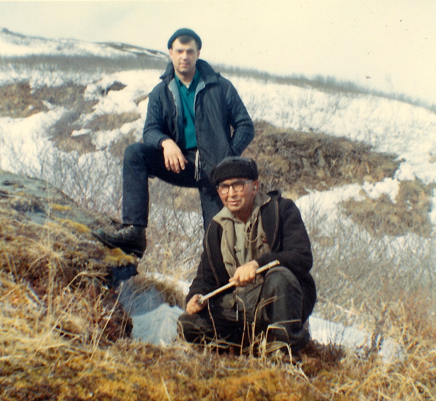 Daniel "Boone" Creed building a small fire as Gary looks my way.