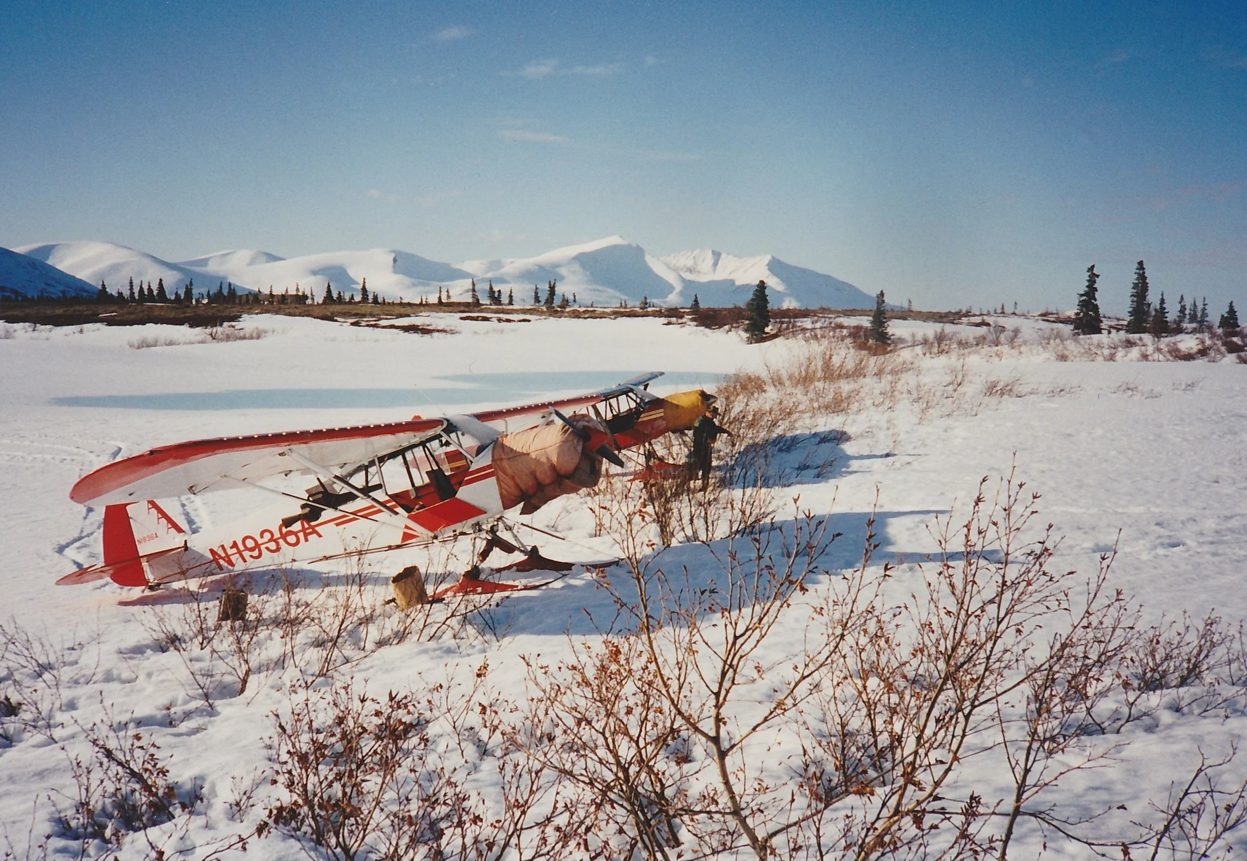 Dan doing the pre-flight on his cub as we get ready for the day. Tikchik Mountain is in the background.