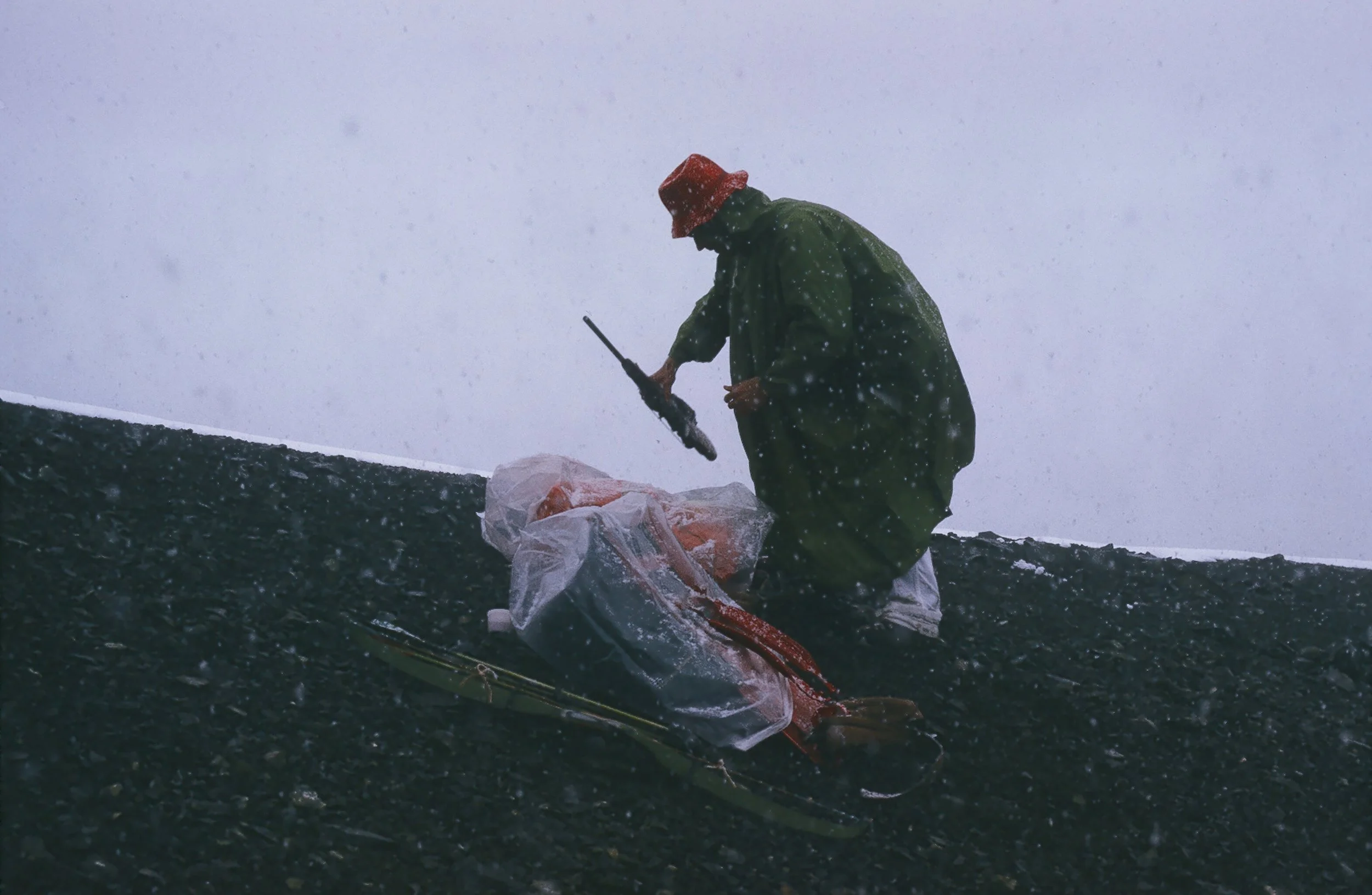 August 10, opening day. Doug trying to keep things dry.